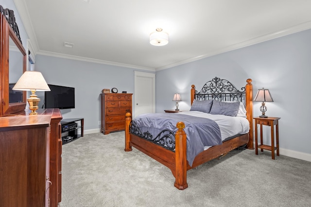 bedroom with crown molding and light colored carpet