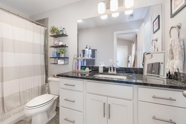 bathroom featuring toilet, tile patterned floors, a shower with shower curtain, and vanity