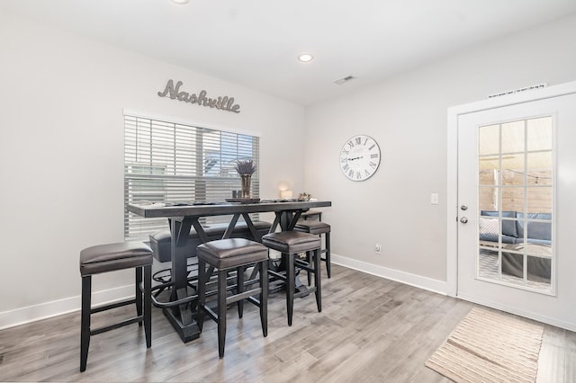 dining room with wood-type flooring