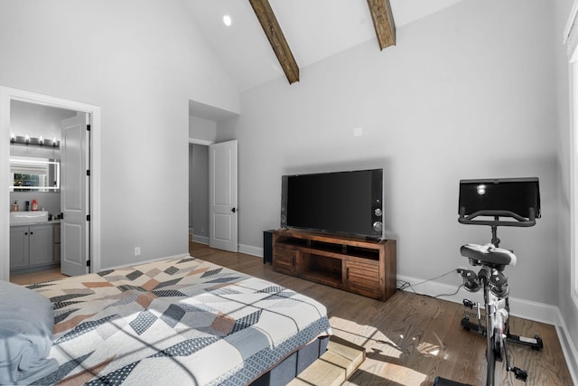 bedroom with high vaulted ceiling, dark wood-type flooring, ensuite bathroom, and beamed ceiling