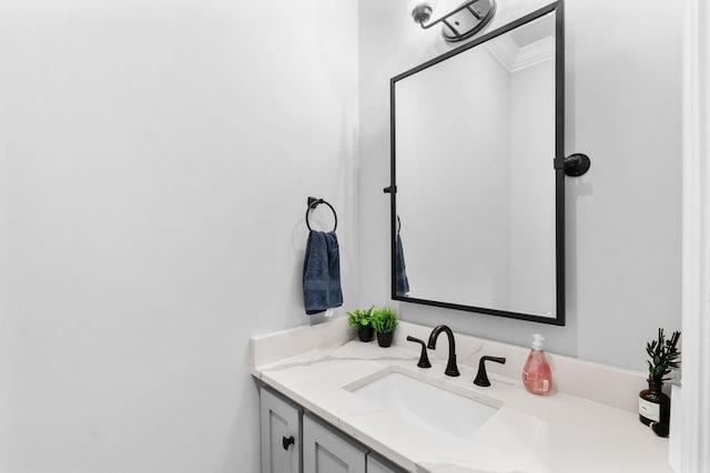 bathroom featuring ornamental molding and vanity