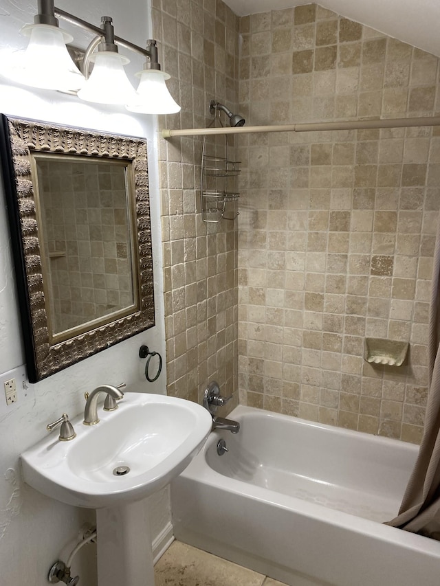 bathroom with shower / bath combination with curtain and tile patterned flooring