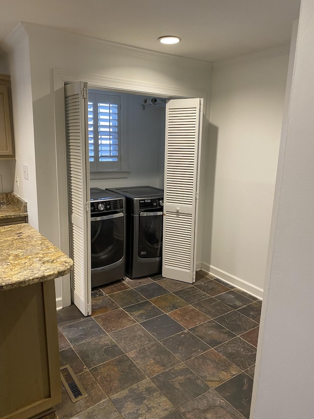 clothes washing area featuring washing machine and dryer