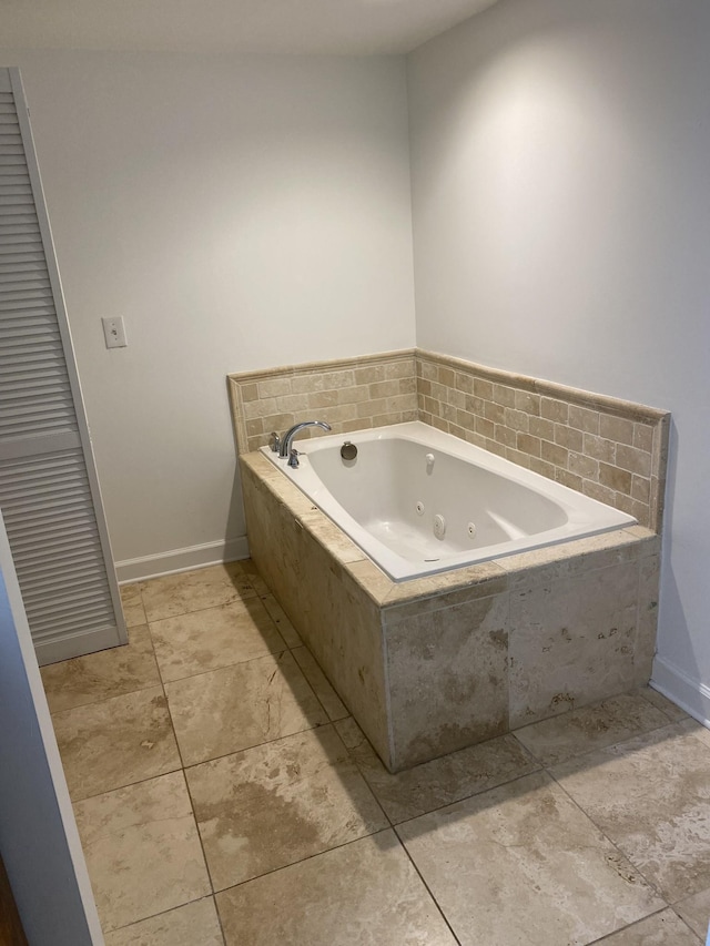 bathroom featuring a relaxing tiled tub