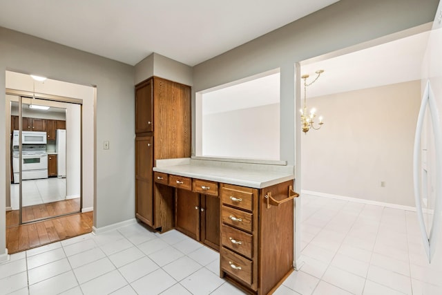 bathroom featuring a chandelier and tile patterned floors