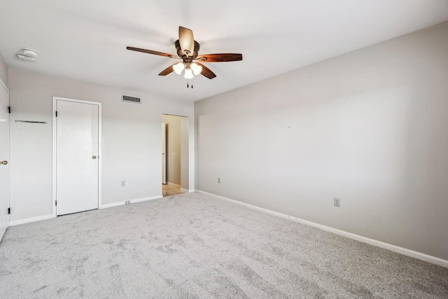 unfurnished bedroom with ceiling fan and light colored carpet