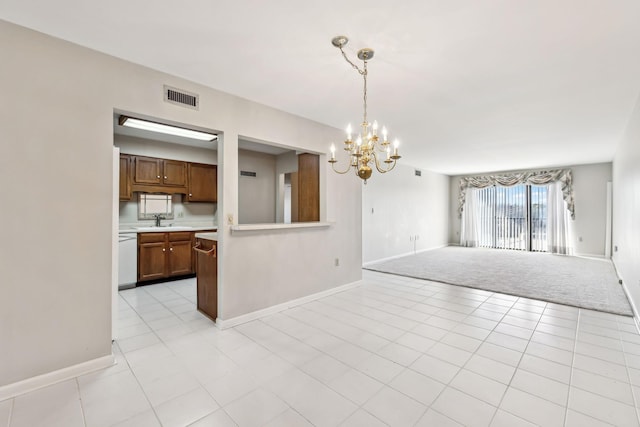 interior space with sink, light tile patterned floors, and a chandelier