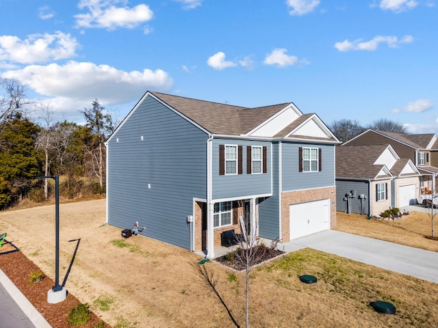 view of front of property with a garage and a front yard