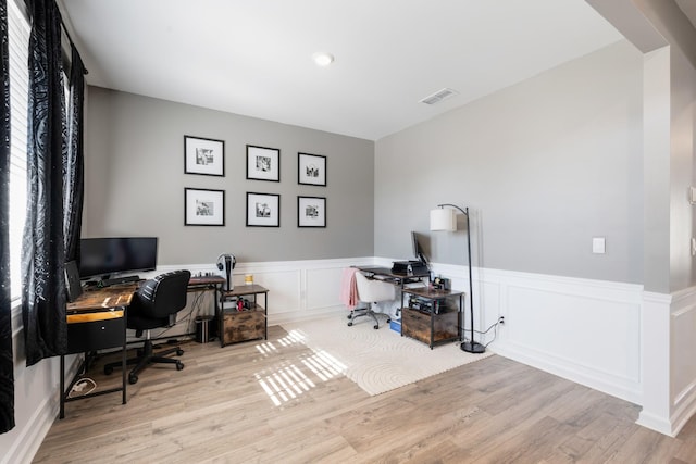 office space with light hardwood / wood-style floors