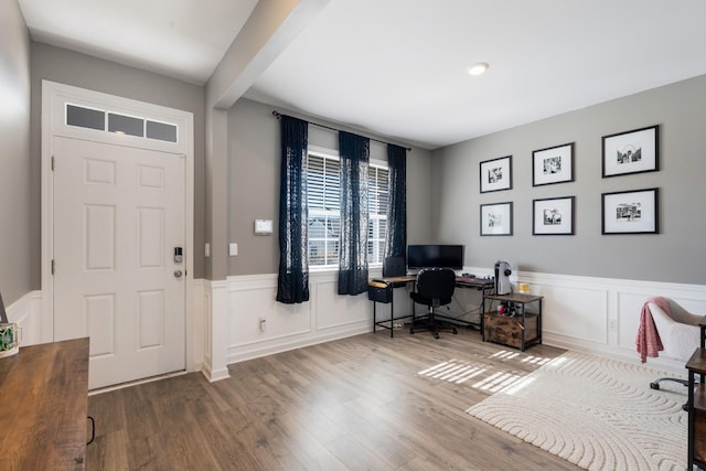 office space featuring hardwood / wood-style flooring and beamed ceiling