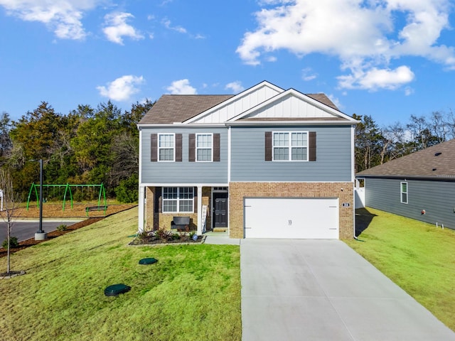 view of front of home featuring a garage, a front yard, and a playground