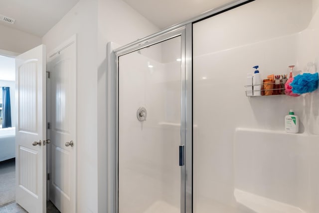 bathroom featuring an enclosed shower