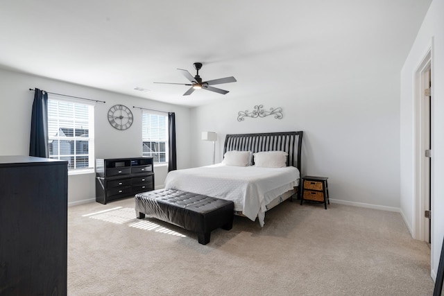 carpeted bedroom with ceiling fan