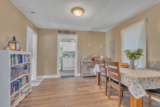 dining room featuring light hardwood / wood-style flooring