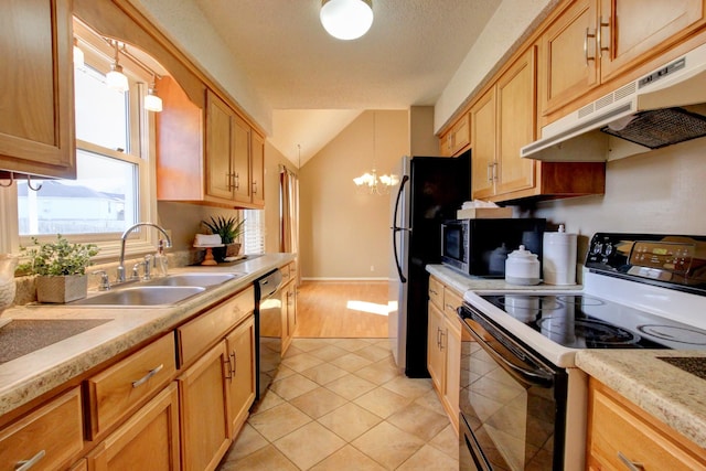 kitchen featuring pendant lighting, sink, light tile patterned floors, stainless steel appliances, and a chandelier