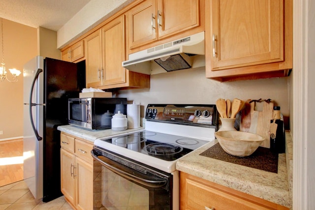 kitchen featuring light tile patterned floors, electric range oven, light stone counters, a chandelier, and light brown cabinets