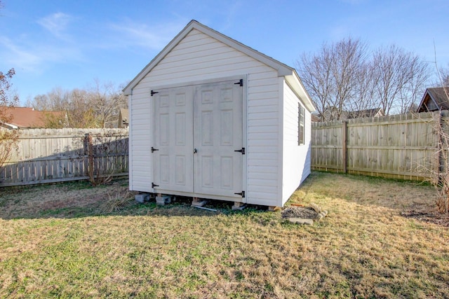 view of outbuilding featuring a yard