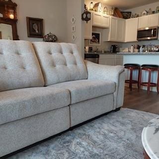 living room with light hardwood / wood-style flooring