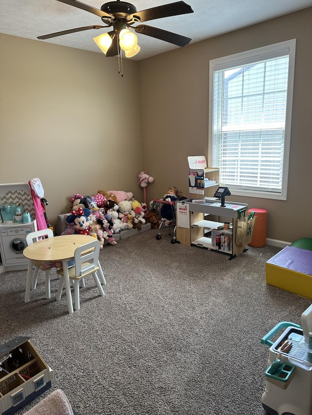 rec room with ceiling fan and carpet