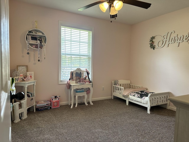 bedroom with dark carpet and ceiling fan