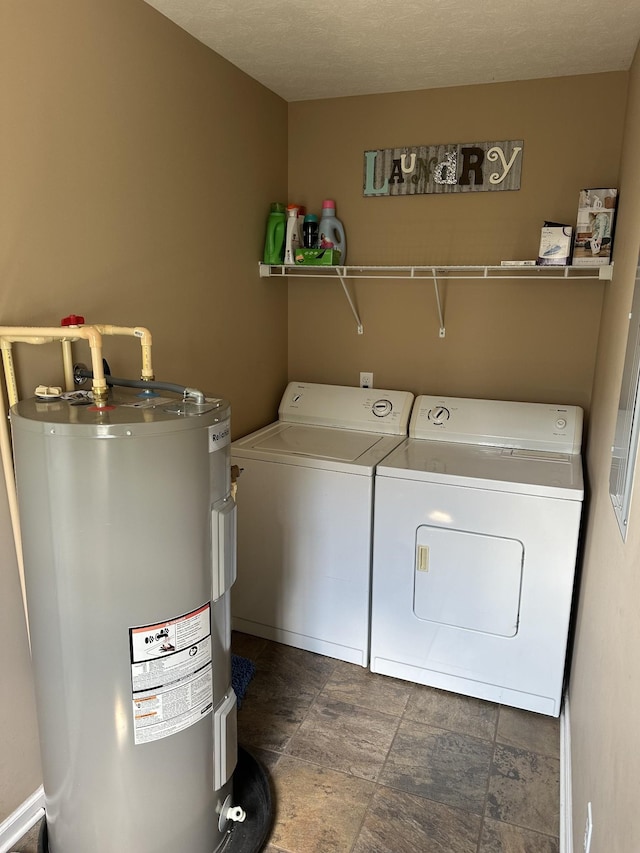 washroom with independent washer and dryer, a textured ceiling, and electric water heater