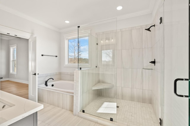 bathroom featuring a garden tub, recessed lighting, vanity, a shower stall, and crown molding