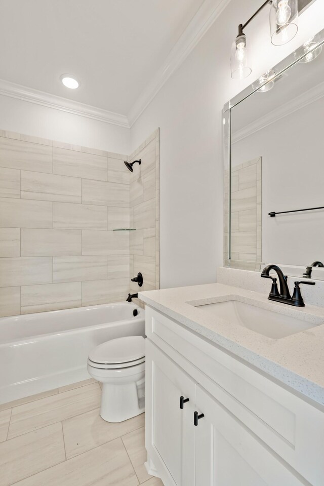 bathroom featuring ornamental molding, bathing tub / shower combination, toilet, and vanity