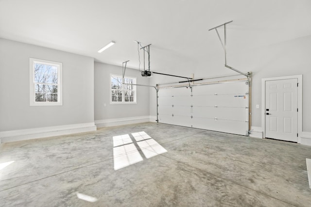 garage featuring baseboards and a garage door opener