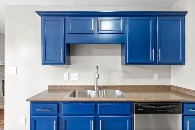 kitchen with blue cabinets, dishwasher, sink, and wood-type flooring