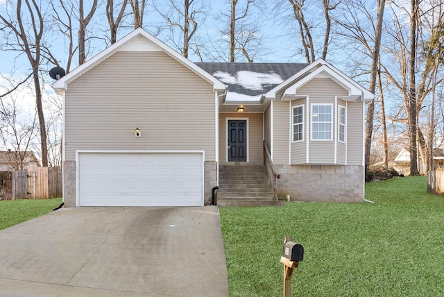 view of front of home featuring a garage and a front lawn