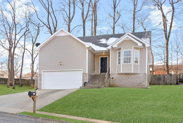 view of front of house featuring a garage and a front yard