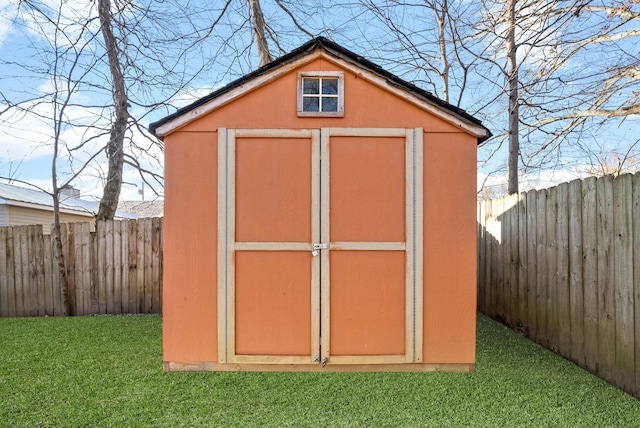 view of outbuilding featuring a lawn