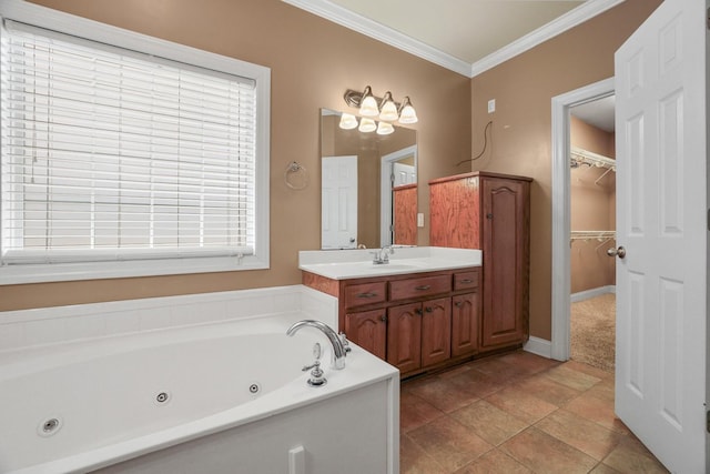 bathroom with a washtub, vanity, crown molding, and a healthy amount of sunlight