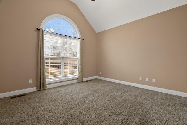 carpeted empty room featuring ceiling fan and lofted ceiling