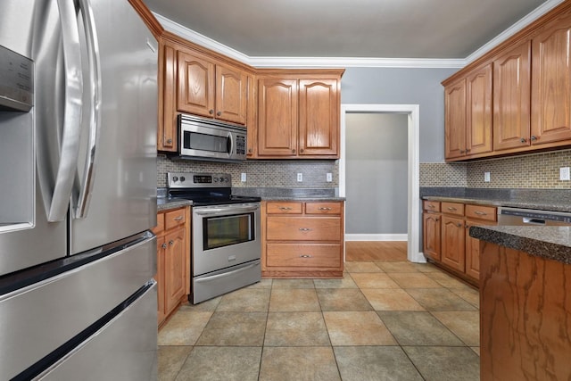 kitchen with ornamental molding, backsplash, and stainless steel appliances