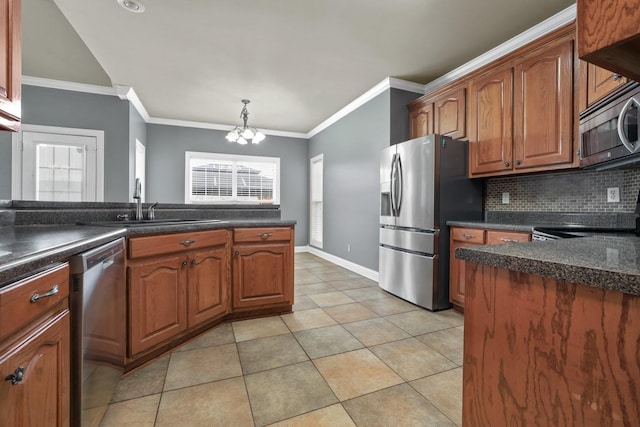 kitchen featuring appliances with stainless steel finishes, light tile patterned floors, decorative backsplash, decorative light fixtures, and ornamental molding