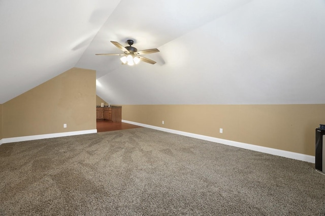 bonus room featuring ceiling fan, carpet floors, and lofted ceiling