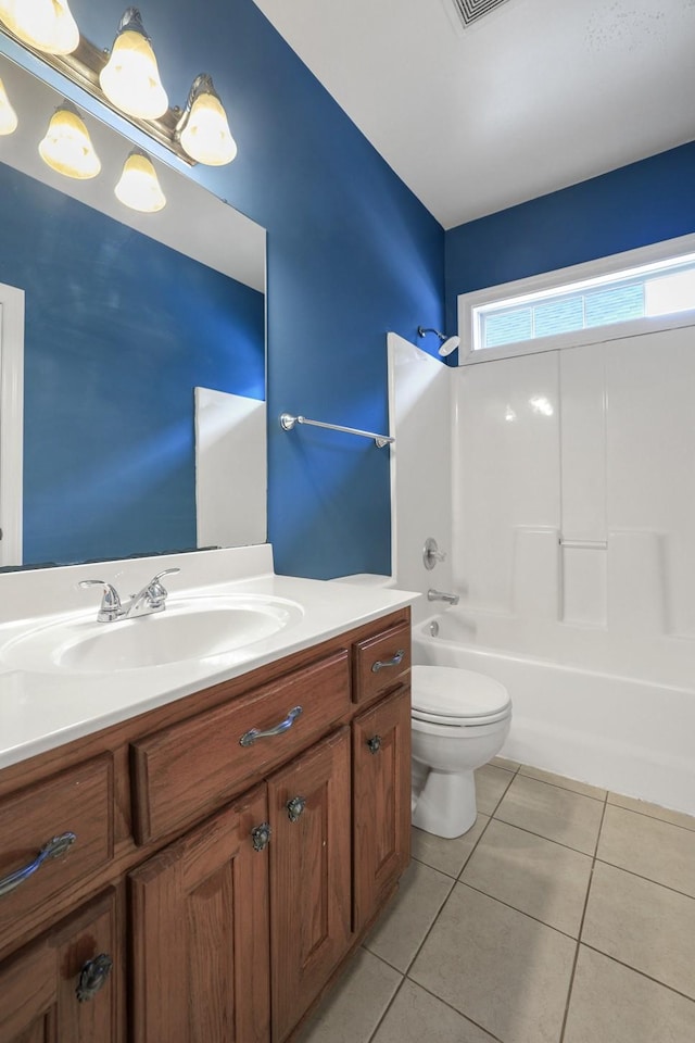 full bathroom featuring vanity, toilet, shower / bathtub combination, and tile patterned flooring