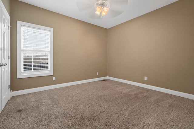 carpeted empty room with ceiling fan