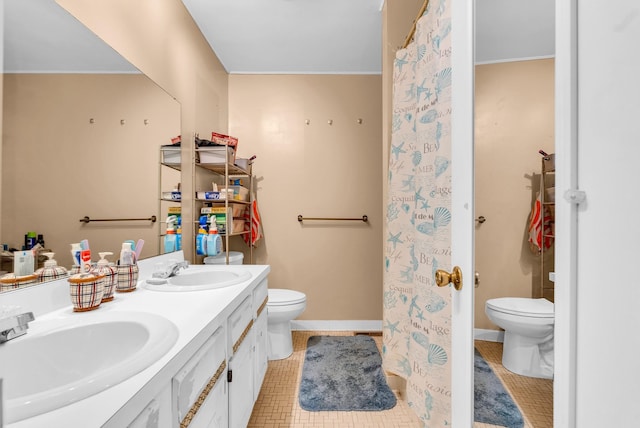 bathroom with toilet and vanity