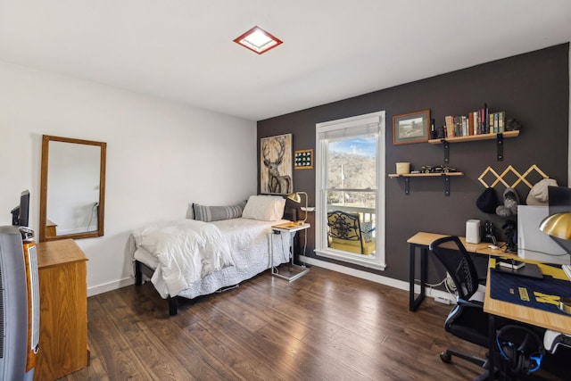 bedroom featuring dark wood-type flooring