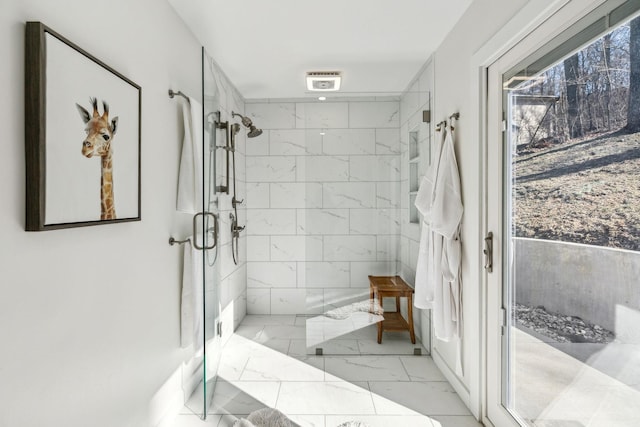 bathroom with a shower with shower door