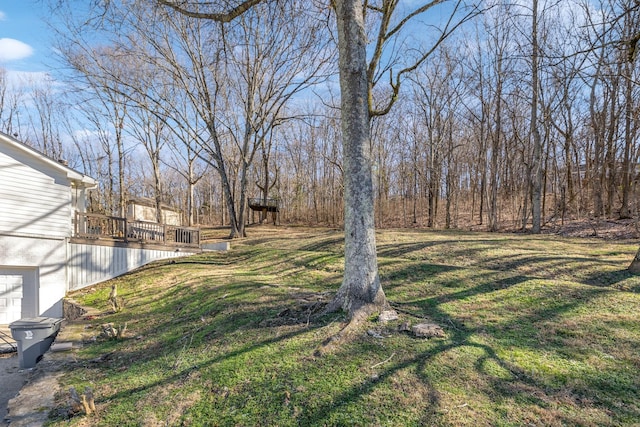 view of yard with a wooden deck