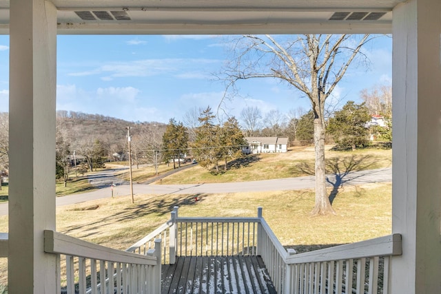 view of yard featuring covered porch