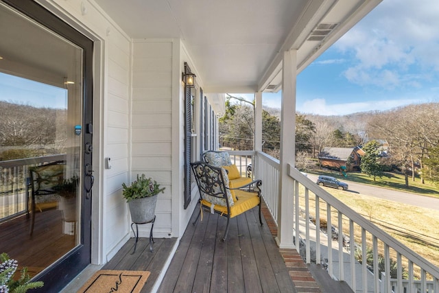 balcony featuring covered porch