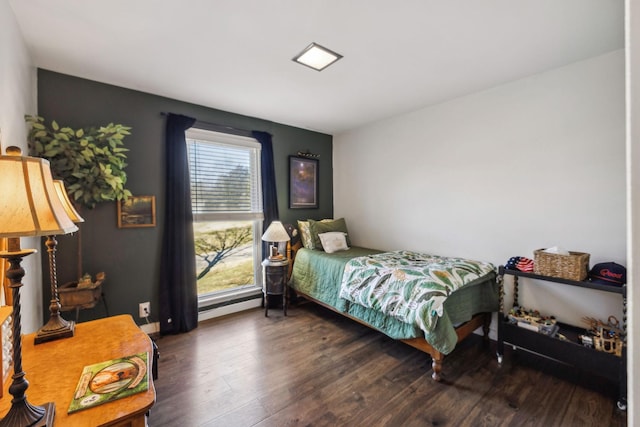 bedroom with dark hardwood / wood-style floors