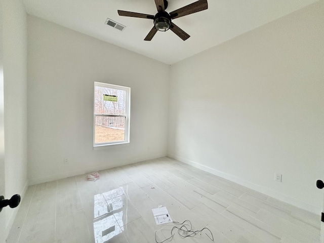 spare room featuring ceiling fan and light wood-type flooring