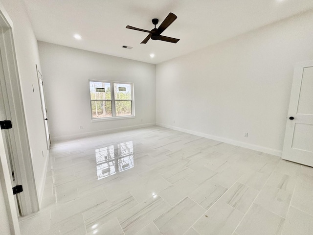 spare room with ceiling fan