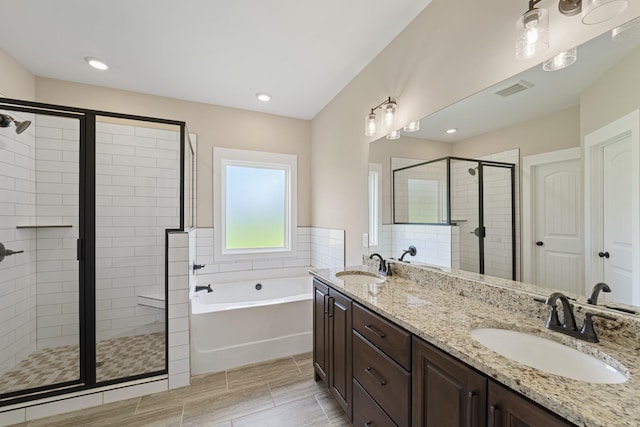 bathroom with vanity and plus walk in shower