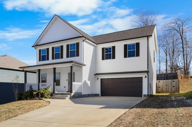 front of property with a garage and covered porch